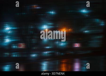 An abstract grid of blurry blue and orange bokeh lights, creating a modern, digital, or urban night feel. Stock Photo