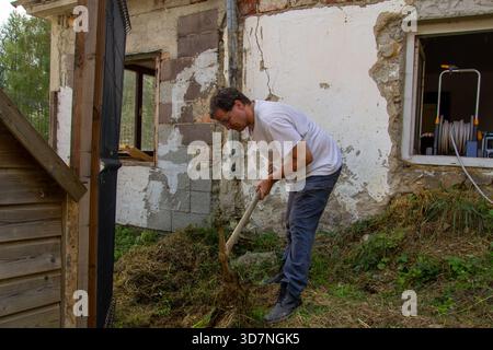 Digging in the mountain with a pickaxe Stock Photo