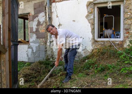 Digging in the mountain with a pickaxe Stock Photo