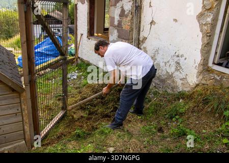 Digging in the mountain with a pickaxe Stock Photo