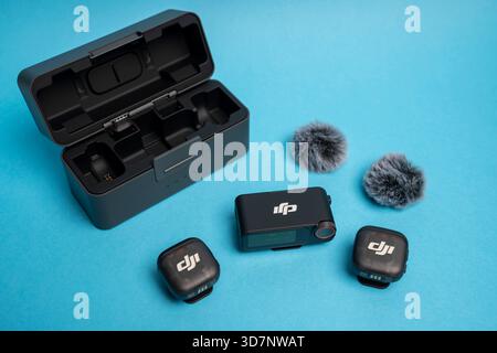 DJI Mic 3 wireless microphone system displayed in a clean, modern studio setup, highlighting its compact design and precise audio performance for crea Stock Photo