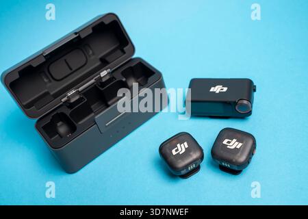DJI Mic 3 wireless microphone system displayed in a clean, modern studio setup, highlighting its compact design and precise audio performance for crea Stock Photo
