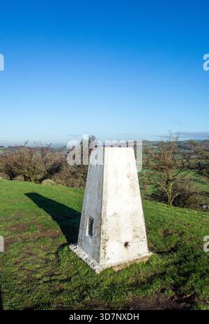 The ordinance survey trig point on the Gritstone trail ridge of Kerridge  hill, Bollington  Cheshire England Stock Photo