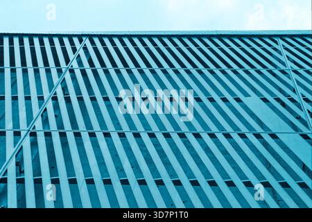 Striking modern building facade with a dynamic texture and pattern. Stock Photo