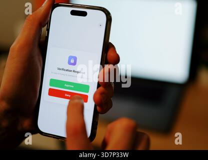 Man Uses Two Factor Authentication to Authorize Application Access Basic Enterprise Information Securtity Concept - 2FA MFA Mobile App Stock Photo