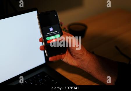 Man Uses Two Factor Authentication to Authorize Application Access Basic Enterprise Information Securtity Concept - 2FA MFA Mobile App Stock Photo