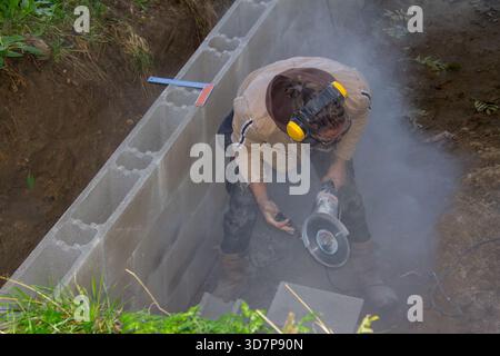 Grinding stones with an angle grinder Stock Photo