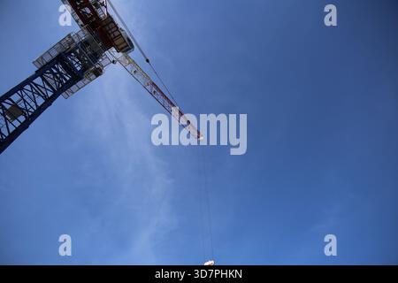Tower Crane Against a Clear Blue Sky Stock Photo