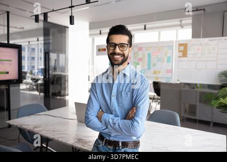 Happy handsome business project manager man posing for portrait Stock Photo