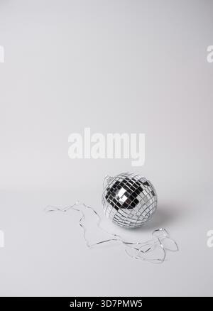 Silver disco ball on white background, space for text Stock Photo