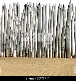 Old Wooden Fence on the Sand Isolated on the White Background Stock Photo
