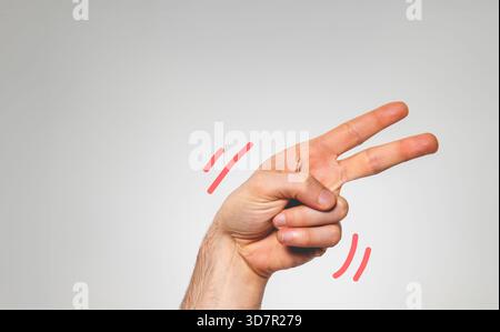 The hand of a young white Caucasian man, gesturing with it and fingers, on white background Stock Photo