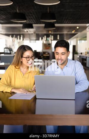 Happy diverse managers working on project task together Stock Photo