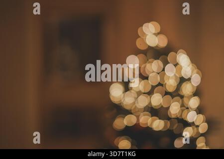 Close-up of Warm Orange Christmas Tree Bokeh (Light Blurs) Stock Photo