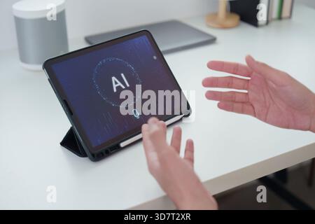 AI Interaction. User engaging with AI interface on tablet for smart solutions. Stock Photo