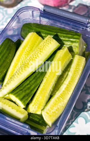 Cucumber cut, cucumber sticks slices, green vegetable cuts for salad isolated, healthy natural plant pieces, macro cucumbers slicing on white backgrou Stock Photo