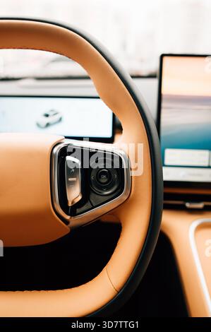 Adjustment buttons on the steering wheel of a car. High quality photo Stock Photo