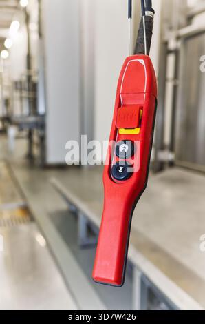 control pendant for a crane , hoist system, handheld, push-button control station used in industrial environments factories and warehouses Stock Photo