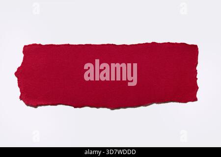 Torn red paper on white background Stock Photo