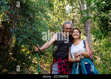 Senior couple enjoying nature while hiking together Stock Photo