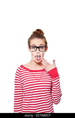 Woman, shock and glasses in studio portrait for deal, wow and mockup space with sale on white background. Person, announcement and open mouth with Stock Photo