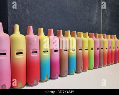 Generic vapes, e-cigarettes. Concept background for concern over health, cancer, plastic use, environment, habit, youth, smoking, vaping. Refillable, Stock Photo
