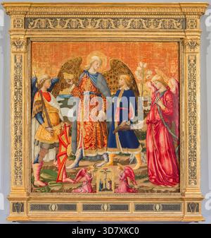 Tobias and Three Archangels, 1471. Tobias (holding a fish) is led by the hand by the Archangel Raphael. On the left is Michael with his sword and shield - at his feet the body of Satan. Gabriel holds lilies, symbol of the Annunciation. Stock Photo