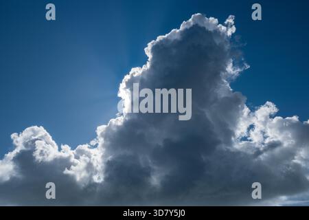 Clouds with sun rays over Atlantic ocean in Finistère, Bretagne France Stock Photo