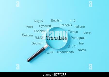 Translation and multilingual communication concept. A magnifying glass focus on word "Translate" surrounded by various global languages, Stock Photo