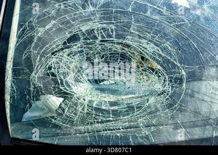 Broken glass in car. Close-Up of shattered windshield. Stock Photo