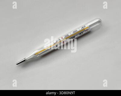 thermometercloseup of precise glass thermometer, highresolution image highlighting reflective medical thermometer, macro photograph emphasizing Stock Photo