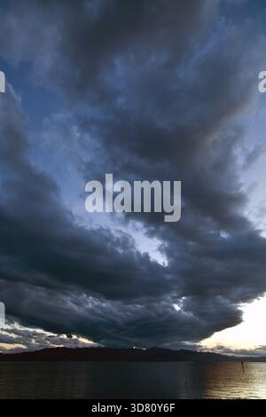 dark clouds over Lake Constance in the evening, Germany, Bavaria, Lindau Stock Photo