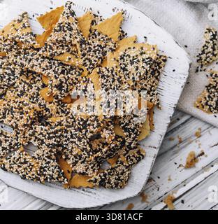 Food, Salted tortilla chips triangle with chia seeds on top view Stock Photo