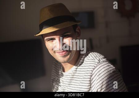 Confident entrepreneur, portrait of happy mature man working as fashion designer and dressmaker in atelier Stock Photo