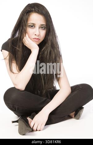 Studio portrait of a pouting asian Mixed-raced teenager Stock Photo