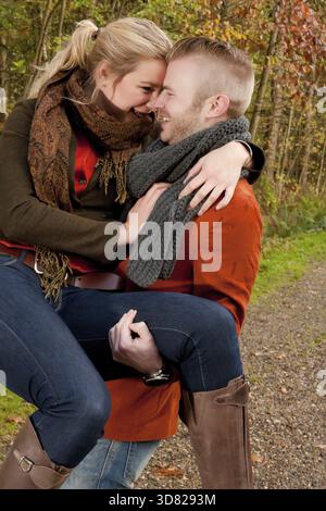 Happy young couple is having a nice time in october Stock Photo