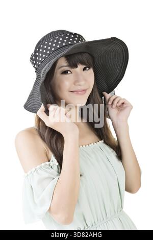 Beautiful elegant asian young woman with black hat. Half length portrait. Isolated on the white background Stock Photo
