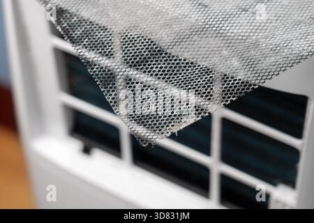 Dusty metal mesh of conditioner air purifier filter close up. Industrial maintenance service concept Stock Photo