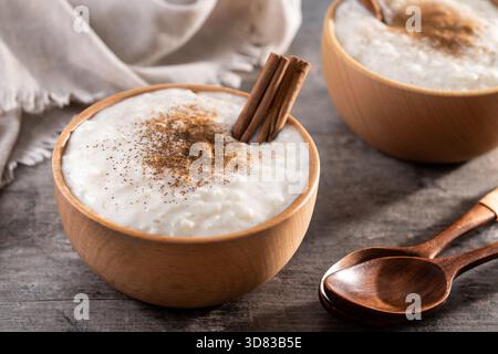 Creamy homemade Spanish custard served in a bowl on wooden table Stock Photo