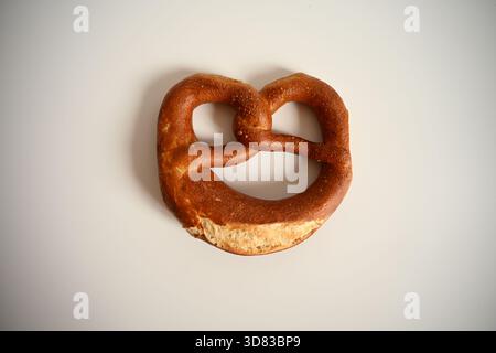 Single Traditional German Pretzel on White Background Stock Photo