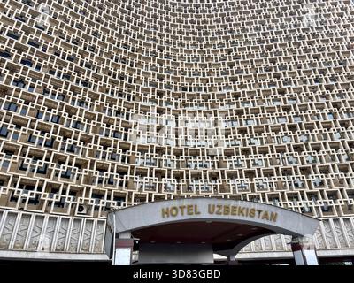 Curving geometric facade and entrance canopy of Hotel Uzbekistan Stock Photo