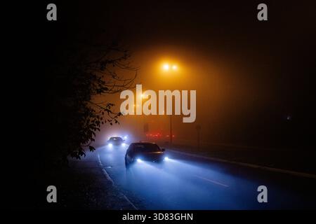 Cars on the highway in the fog Stock Photo