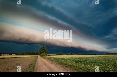 Super shelf, arcus storm cloud over the fields in summer, Lithuania Stock Photo