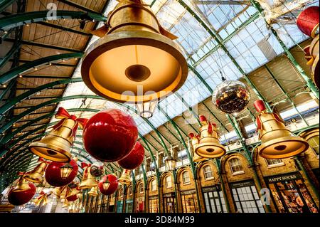 London, UK. Christmas decorations in Covent Garden covered market, November 2025 Stock Photo