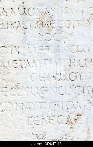 ancient marble, stone texture from ancient stone rock wall with european scripts Stock Photo