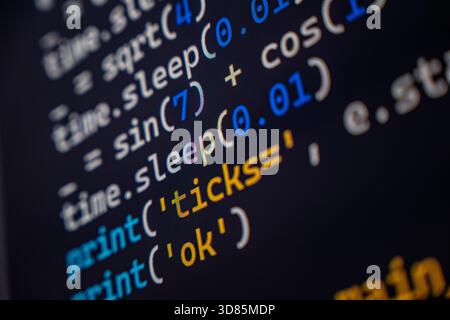 A detailed view of programming code displayed on a computer screen, showcasing syntax highlighting in various colors. Stock Photo