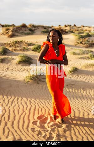 Woman in red dress at sunset in the dunes hi-res stock photography and  images - Alamy