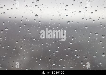 Raindrops on Window Glass Background Texture Stock Photo