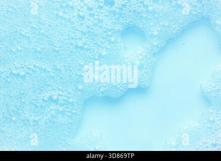 Abstract blue background with delicate soap foam bubbles in light tinted water, creating soft texture and airy pattern useful for clean design Stock Photo