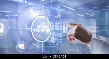 Hand pressing a button with the inscription Dental Treatment on a touch screen. Stock Photo